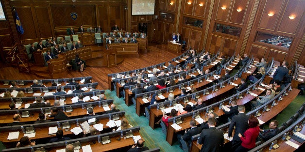 Kosovo lawmakers attend a Parliament session in capital Pristina on Monday, Nov. 2, 2015. Kosovo Parliament has voted overwhelmingly to ratify the Stabilization and Association Agreement with the European Union, considered a milestone for its economic growth. The 120-seat Parliament voted with 86 votes for the deal signed last week in Strasbourg, France, that opens the way to eventual full membership in the EU, Kosovo's main trading partner. (AP Photo/Visar Kryeziu)