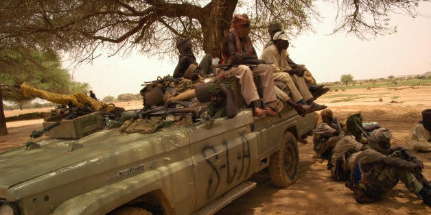 NORTH DARFUR, SUDAN: Sudan Liberation Movement (SLM) militants wait to receive the African Union mediator in the Darfur conflict, Salim Ahmed Salim, at the SLA-controlled Galoul locality in Jebel Marra area in North Darfur State, 31 August 2005. 'The SLM leaders declared their commitment to the peace process and their acknowledgement of the role being played by the AU troops in Darfur,' an AU spokesman said, in reference to 6,000 peacekeepers on the ground. AFP PHOTO/SALAH OMAR (Photo credit should read SALAH OMAR/AFP/Getty Images)