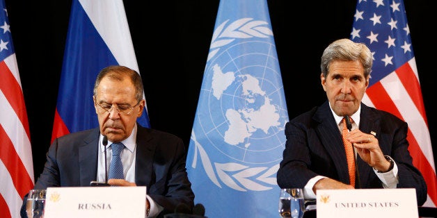 U.S. Secretary of State John Kerry, right, and Russian Foreign Minister Sergey Lavrov arrive for a news conference after the International Syria Support Group (ISSG) meeting in Munich, Germany, Friday, Feb. 12, 2016. (AP Photo/Matthias Schrader)