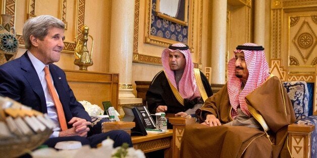 US Secretary of State John Kerry (L) meets with Saudi King Salman bin Abdulaziz (R) on January 23, 2016 at the King's farm, on the outskirts of the capital Riyadh. Kerry arrived in Saudi Arabia hoping for an easing of tensions between the Sunni power and its predominantly Shiite rival Iran. / AFP / POOL / Jacquelyn Martin (Photo credit should read JACQUELYN MARTIN/AFP/Getty Images)