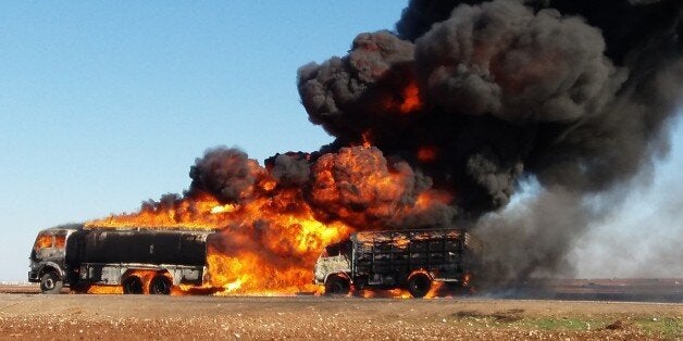 ALEPPO, SYRIA - DECEMBER 4: Smoke rises after the war crafts belonging to the Russian Army bombed the semi-trailer trucks which were carrying humanitarian aid in the Kafr Nasih region in northern Aleppo, Syria on December 4, 2015. (Photo by Beha el Halebi/Anadolu Agency/Getty Images)