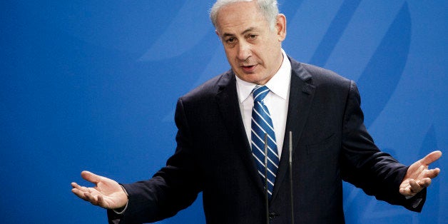 BERLIN, GERMANY - FEBRUARY 16: Israeli Prime Minister Benjamin Netanyahu gestures during a press conference together with German Chancellor Angela Merkel at the Chancellery following the 6th German-Israeli government consultations on February 16, 2016 in Berlin, Germany. The two governments are scheduled to discuss issues including the Middle East peace process, cyber crime, German-language education in Israel, climate change and development policy in Africa. (Photo by Carsten Koall/Getty Images)