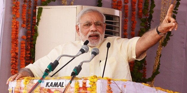 MATHURA, INDIA - MAY 25: Prime Minister Narendra Modi addressing to thousands of supporters who gathered to listen to him in extreme hot weather at Jan Kalyan Sabha on May 25, 2015 in Mathura, India. (Photo by Ramesh Pathania/Mint via Getty Images)