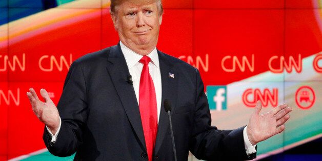 Donald Trump reacts during the CNN Republican presidential debate at the Venetian Hotel & Casino on Tuesday, Dec. 15, 2015, in Las Vegas. (AP Photo/John Locher)
