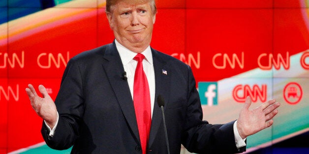 Donald Trump reacts during the CNN Republican presidential debate at the Venetian Hotel & Casino on Tuesday, Dec. 15, 201