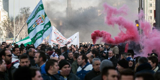 MADRID, SPAIN - 2016/02/18: Taxi drivers protesting against liberalization of their sector and against services like uber and