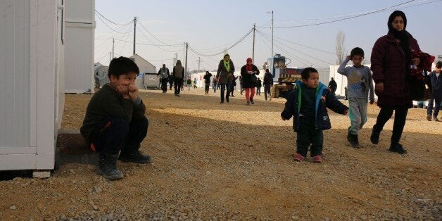 TABANOVCE, MACEDONIA - FEBRUARY 23: Refugees, who are stuck in Macedonia as Serbia does not let them to pass border, wait at Macedonia - Serbia border, in Tabanovce town, Macedonia on February 23, 2016. (Photo by Vedat Abdul/Anadolu Agency/Getty Images)