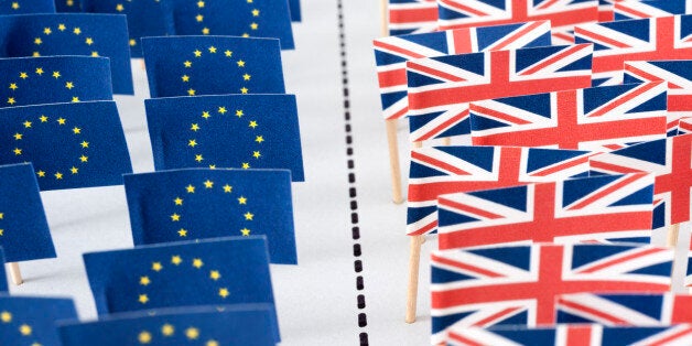 Conceptual image of American and British flags separated by dotted line