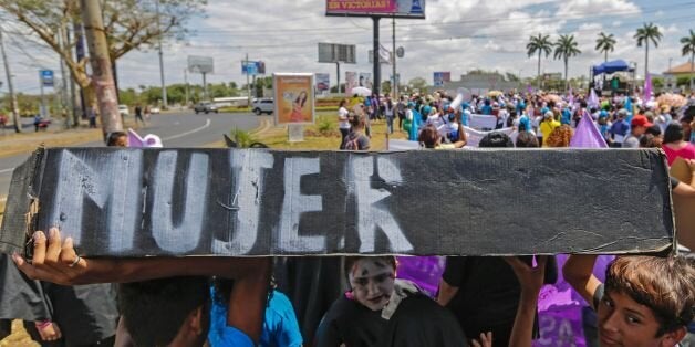 People take part in a march during the International Women Day in Managua on March 8, 2016. The march was to demand an international commission to investigate the murder of Honduran Human Rights activist, Coordinator of the Civil Council of Popular and Indigenous Organizations of Honduras (COPINH) Berta Caceres Flores, who was killed on March 3 in La Esperanza, Honduras. AFP PHOTO/ Inti OCON / AFP / Inti Ocon (Photo credit should read INTI OCON/AFP/Getty Images)