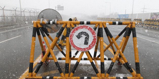 In this Feb. 16, 2016, photo, a barricade is placed on the Unification Bridge, which leads to the demilitarized zone, near the border village of Panmunjom, in Paju, South Korea. Furious about North Koreaâs recent nuclear test and long-range rocket launch, South Korea vows to hit back hard and says the shutdown of a jointly run factory park in the North will only be the start.(AP Photo/Ahn Young-joon)
