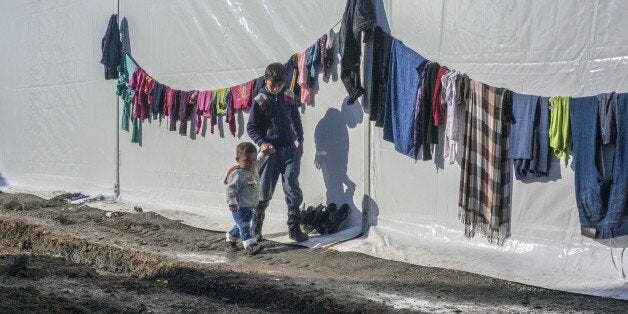 IDOMENI, GREECE - MARCH 11: Syrian refugees are seen in a refugee camp of Idomeni, Greece on March 11, 2016. Refugees wait at a makeshift camp along the Greece-Macedonia border in Idomeni village as they trapped at border after Macedonia closed the border for refugees. (Photo by Iker Pastor/Anadolu Agency/Getty Images)