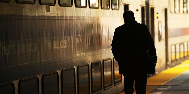 NEWARK, NJ - MARCH 08: A man walks along a NJ Transit train platform as a strike looms on one of the nations most popular com