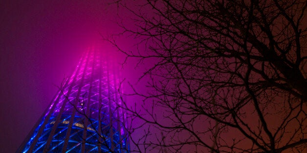 BEIJING, CHINA - MARCH 19: Guangzhou Tower with lights on before the 2016 Earth Hour event on March 19, 2016 in Guangzhou, C