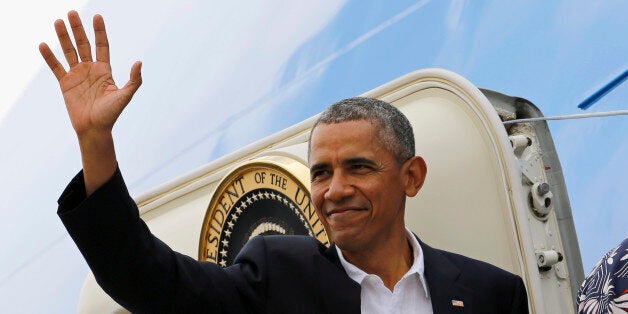 President Barack Obama waves goodbye as he boards Air Force One on his way to Argentina, as he leaves Havana, Cuba, Tuesday,
