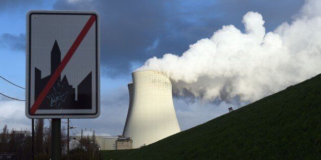 This photo taken on January 12, 2016 shows the cooling towers of Belgium's Doel nuclear plant belching thick white steam. They are part of a groundswell of concern in the Netherlands, Germany and Luxembourg over the safety of Belgium's seven ageing reactors at Doel and at Tihange, further to the south and east. / AFP / EMMANUEL DUNAND (Photo credit should read EMMANUEL DUNAND/AFP/Getty Images)
