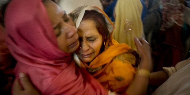Pakistani Christian women mourn the deaths of their family members during a funeral service at a local church in Lahore, Pakistan, Monday, March 28, 2016. The death toll from a massive suicide bombing targeting Christians gathered on Easter in the eastern Pakistani city of Lahore rose on Monday as the country started observing a three-day mourning period following the attack. (AP Photo/B.K. Bangash)