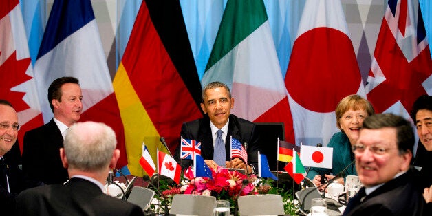 U.S. President Barack Obama (C) participates in a G7 leaders meeting during the Nuclear Security Summit in The Hague March 24, 2014. At the table are the President of the European Council Herman Van Rompuy, French President Francois Hollande, British Prime Minister David Cameron, Obama, German Chancellor Angela Merkel, Japanese Prime Minister Shinzo Abe and President of the European Commission Jose Manuel Barroso. (L-R, clockwise). REUTERS/Jerry Lampen/Pool (NETHERLANDS - Tags: POLITICS) 