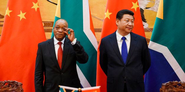 South African President Jacob Zuma (L) and Chinese President Xi Jinping (R) attend a signing ceremony at the Great Hall of the People in Beijing, December 4, 2014. REUTERS/Wang Zhao/Pool (CHINA - Tags: POLITICS)