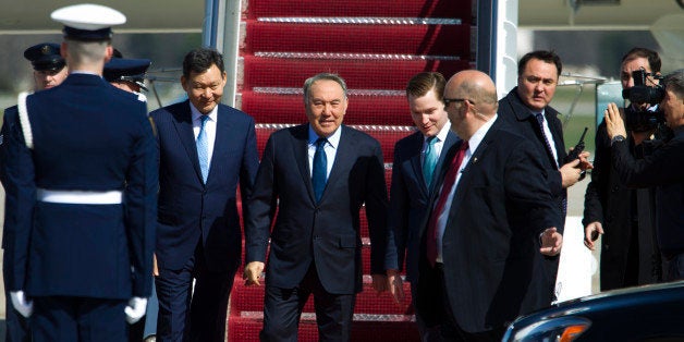Kazakhstan President Nursultan Nazarbayev walks down the stairs from a plane upon his arrival at Andrews Air Force Base, Md.,