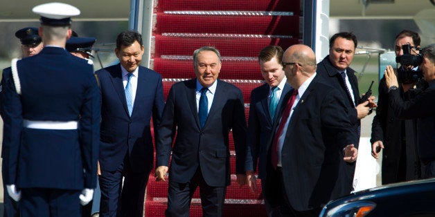 Kazakhstan President Nursultan Nazarbayev walks down the stairs from a plane upon his arrival at Andrews Air Force Base, Md., Wednesday, March 30, 2016. Nazarbayev is in Washington to attend the Nuclear Security Summit. (AP Photo/Jose Luis Magana)