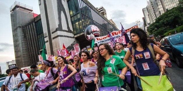 SAO PAULO, BRAZIL - APRIL 01: Thousands of people, dissatisfied with the current government, hold banners and posters during a demonstration for new general elections, at Paulista Avenue, in Sao Paulo, Brazil on April 1, 2016. (Photo by DÃ¡rio Oliveira/Anadolu Agency/Getty Images)