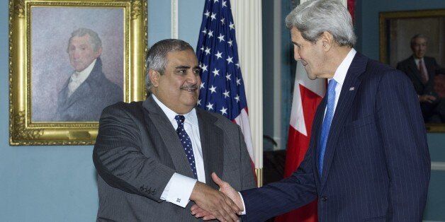 US Secretary of State John Kerry(R) and Bahrain's Foreign Affairs Minister Sheik Khaled bin Ahmed al-Khalifa shake hands after delivering remarks to the media on November 19, 2015 at the State Department in Washington, DC. AFP PHOTO/PAUL J. RICHARDS (Photo credit should read PAUL J. RICHARDS/AFP/Getty Images)