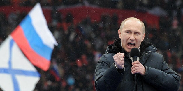 Russian Presidential candidate, Prime Minister Vladimir Putin delivers a speech during a rally of his supporters at the Luzhniki stadium in Moscow on February 23, 2012. Prime Minister Vladimir Putin on Thursday vowed he would not allow foreign powers to interfere in Russia's internal affairs and predicted victory in an ongoing battle for its future. 'We will not allow anyone interfere in our internal affairs,' Putin said in a speech to more than 100,000 people packed into the stadium and its grounds at Moscow's Luzhniki stadium ahead of March 4 presidential elections. . AFP PHOTO/AFP PHOTO / YURI KADOBNOV (Photo credit should read YURI KADOBNOV/AFP/Getty Images)