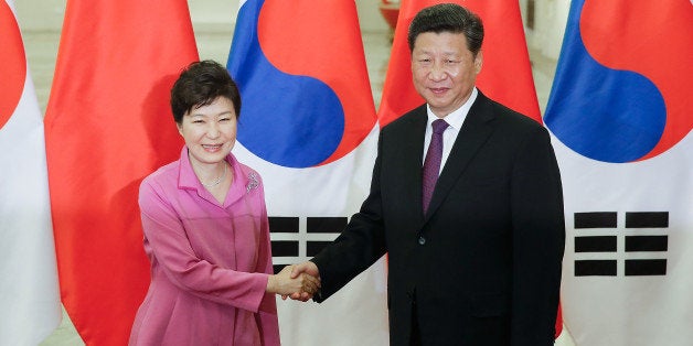 BEIJING, CHINA - SEPTEMBER 02: Chinese President Xi Jinping (R) shankes hands with South Korean President Park Geun-hye (L)