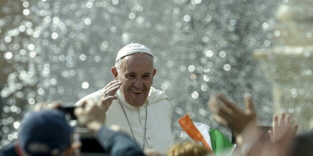 Pope Francis (C) waves to faithfull as he arrives for his special Jubilee Audience at Saint Peter's Square at the Vatican on April 9, 2016. / AFP / ANDREAS SOLARO (Photo credit should read ANDREAS SOLARO/AFP/Getty Images)