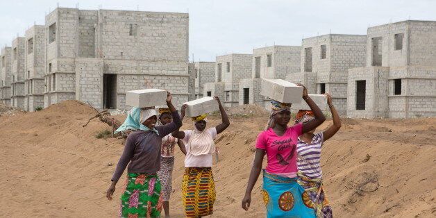 Women carry bricks at the construction site of real estate company Sipim in Grand Bassam, Ivory Coast, September 15, 2015. They are paid 25 West African francs (about $0.04) for each brick they carry. From AbidjanÃ¢â¬â¢s packed airport arrivals hall to the buildings mushrooming across the capital, Ivory Coast is booming, a rare African bright spot as the worldÃ¢â¬â¢s biggest cocoa producer bounces back from a 2011 civil war. Buyers of luxury apartments include Ivorians living overseas, while promoters from Morocco, Turkey and China are attracted by tax breaks. Elections - the source of national unrest four years ago - are due in a month but there is no let-up in investment given expectations of an easy victory for incumbent Alassane Ouattara. The government predicts 9.6 percent growth this year, making the former French colony the standout performer on a continent hammered by a slump in commodity prices, capital outflows and tumbling currencies. REUTERS/Joe PenneyPICTURE 19 OF 33 FOR WIDER IMAGE STORY "IVORY COAST IS BOOMING". SEARCH "BOOMING PENNEY" FOR ALL IMAGES