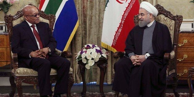 In this photo released by the official website of the office of the Iranian Presidency, President Hassan Rouhani, right, meet