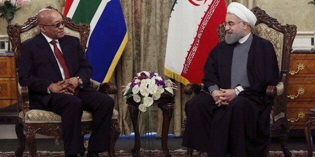 In this photo released by the official website of the office of the Iranian Presidency, President Hassan Rouhani, right, meets with his South African counterpart Jacob Zuma at the Saadabad palace in Tehran, Iran, Sunday, April 24, 2016. (Iranian Presidency Office via AP)