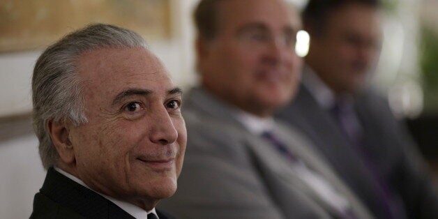 Brazil's Vice President Michel Temer (L) looks on near President of the Brazilian Senate Renan Calheiros (C) and opposition Senator Aecio Neves (R) of the Brazilian Social Democracy Party (PSDB) during a meeting in Brasilia, Brazil April 27, 2016. REUTERS/Ueslei Marcelino TPX IMAGES OF THE DAY 