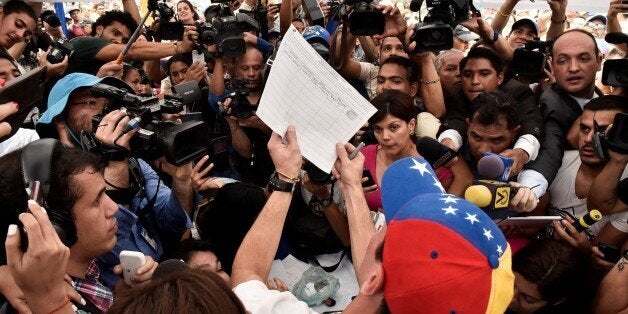 CARACAS, VENEZUELA - APRIL 27: Opposition leader and Miranda State Governor Henrique Capriles arrives to sign the forms for the referendum petition to revoke Venezuelan President Nicolas Maduro in Caracas, Venezuela on April 27, 2016. Venezuelas National Electoral Council (CNE) gave approval to opposition leaders to begin a process that could lead to a recall vote against President Nicolas Maduro. The CNE authorized the collection of signatures, within 30 days, of 1 percent of registered voters. If successful, a second round of signature collection would proceed with 20 percent of voters needed. (Photo by Carlos Becerra/Anadolu Agency/Getty Images)