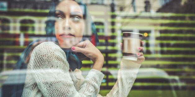 Portrait of a woman on the window of a cafe in Istanbul.