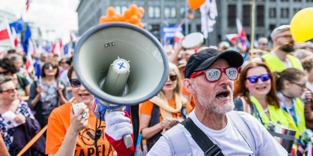 People protest against the right-wing government in Warsaw, Poland, on May 07, 2016
Around a quarter of a million Poles floo