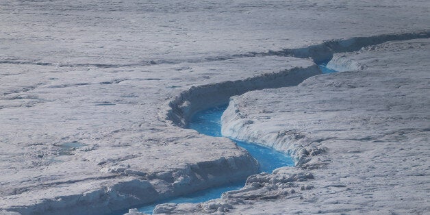 GLACIAL ICE SHEET, GREENLAND - JULY 17: Water is seen on part of the glacial ice sheet that covers about 80 percent of the country is seen on July 17, 2013 on the Glacial Ice Sheet, Greenland. As the sea levels around the globe rise, researchers affilitated with the National Science Foundation and other organizations are studying the phenomena of the melting glaciers and its long-term ramifications. The warmer temperatures that have had an effect on the glaciers in Greenland also have altered the ways in which the local populace farm, fish, hunt and even travel across land. In recent years, sea level rise in places such as Miami Beach has led to increased street flooding and prompted leaders such as New York City Mayor Michael Bloomberg to propose a $19.5 billion plan to boost the citys capacity to withstand future extreme weather events by, among other things, devising mechanisms to withstand flooding. (Photo by Joe Raedle/Getty Images)