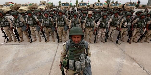 Kurdish Peshmerga fighters show their skills during a graduation ceremony on May 5, 2016 at the Kurdistan Training Coordination Center (KTTC) of Arbil, the capital of the autonomous Kurdish region of northern Iraq.The KTTC is a joint effort of the Dutch, Italian, British and German governments which aims to unify the military assistance of these countries. / AFP / SAFIN HAMED (Photo credit should read SAFIN HAMED/AFP/Getty Images)