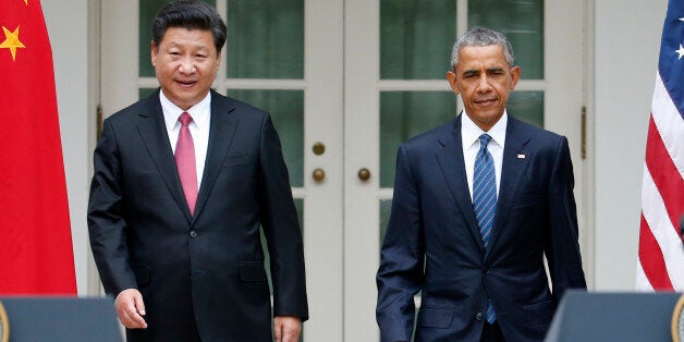 President Barack Obama and Chinese President Xi Jinping arrive for their joint new conference, Friday, Sept. 25,2015, in the Rose Garden of the White House in Washington. (AP Photo/Evan Vucci)