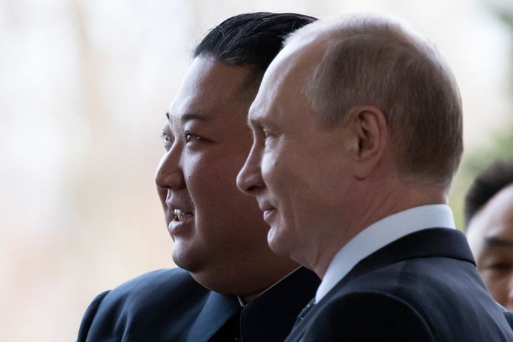 Russian President Vladimir Putin, right, and North Korea's leader Kim Jong Un pose for a photo prior to their talks in Vladiv