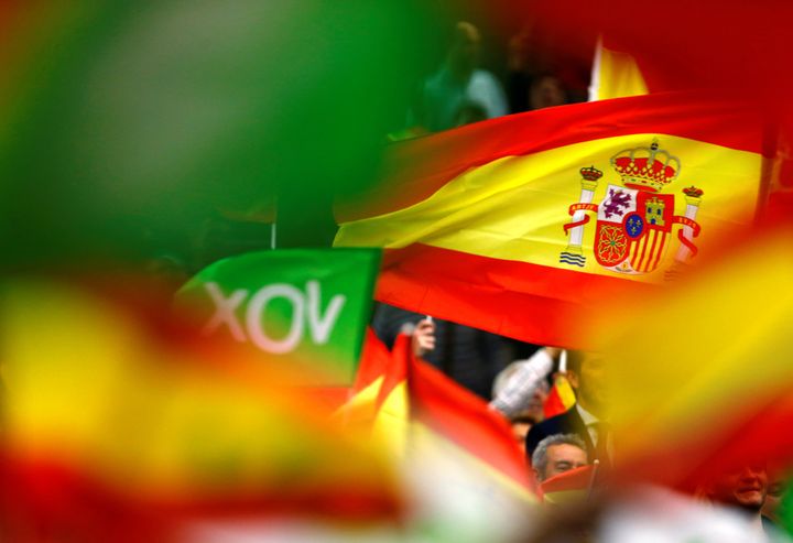 Spain's far-right party VOX supporters wave Spanish flags during an electoral rally ahead of general elections in the Andalusian capital of Seville, Spain April 24.