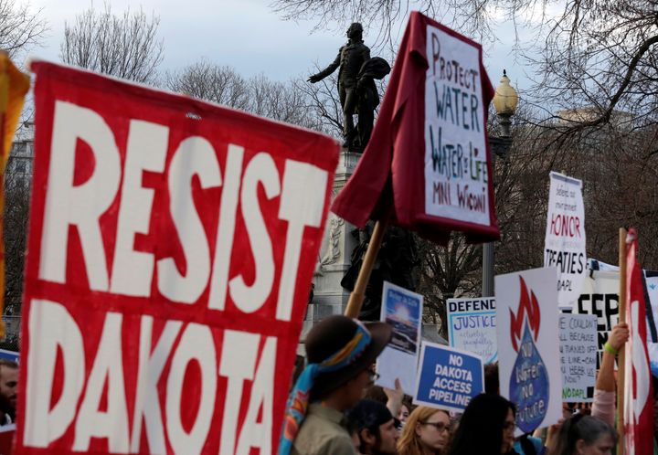 People protest at the White House against President Donald Trump's directive to permit the Dakota Access Pipeline project to move forward in February 2017.