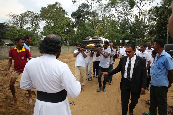 Relatives carry the coffin of a victim of Easter Sunday's bomb blast at St. Sebastian Church, in Negombo, Sri Lanka Thursday, April 25, 2019.