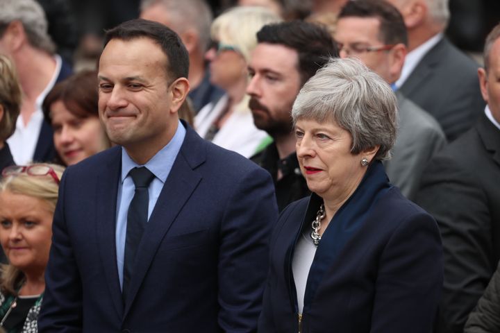 Irish Taoiseach Leo Varadkar and UK Prime Minister Theresa May leave the funeral service of murdered journalist Lyra McKee at St Anne's Cathedral in Belfast.