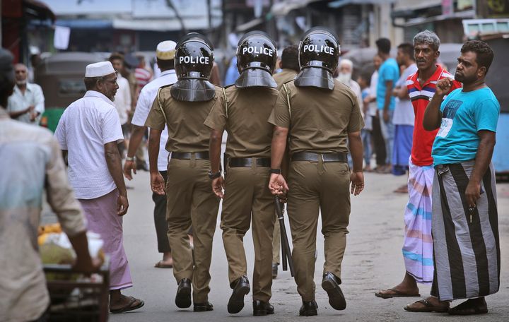 Sri Lankan policeman patrol in a Muslim neighborhood before Friday prayers in Colombo, Sri Lanka, on Friday.