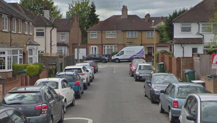 The two female victims were found in a quiet residential street in Watford, Herts, above, after a struggle with a male suspect.