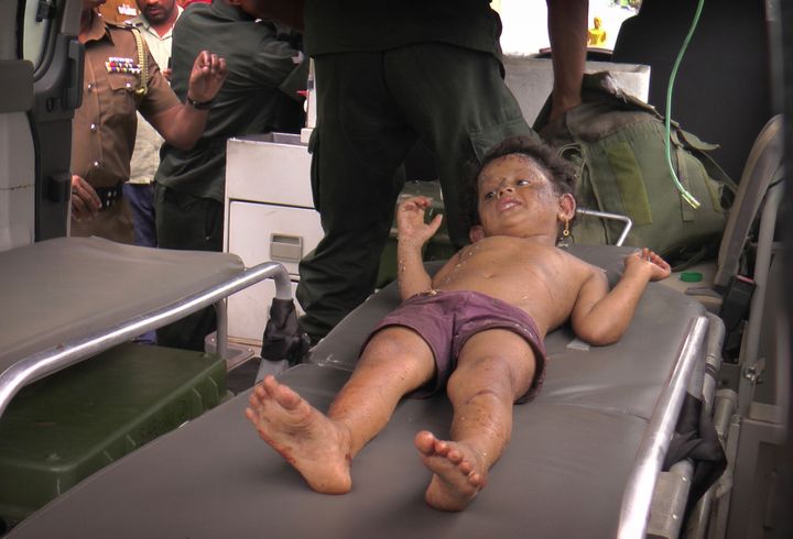 A Sri Lankan girl is taken to hospital after he was found at the site of an explosion and a gunbattle in Kalmunai,