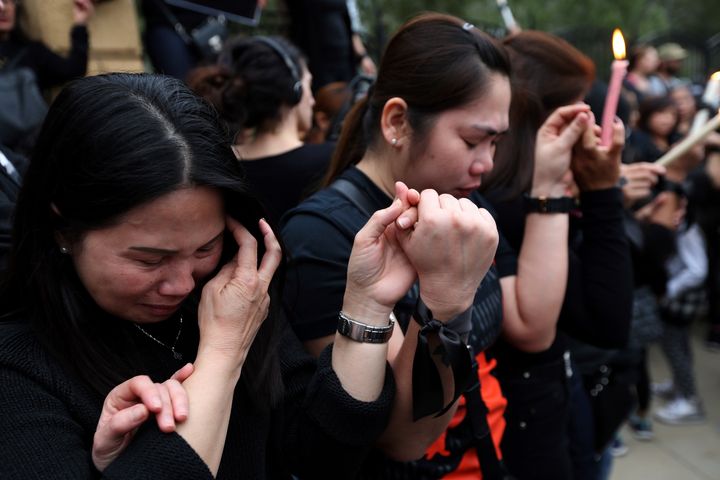 Filipino women gather in Cyprus to mourn the killings.