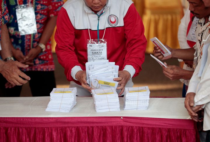 Electoral workers count ballots during the election at a polling station in Jakarta, Indonesia, on April 17, 2019.