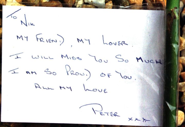 A card for Nik Moore, who died in the blast, from his partner Peter.